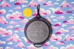 Lodge 13.25 Inch Dolly Parton Pre-Seasoned Cast Iron Stamped Skillet - Signature Teardrop Handle - Use in the Oven, on the Stove, on the Grill, or Over a Campfire - Clear Blue Morning - Image 3