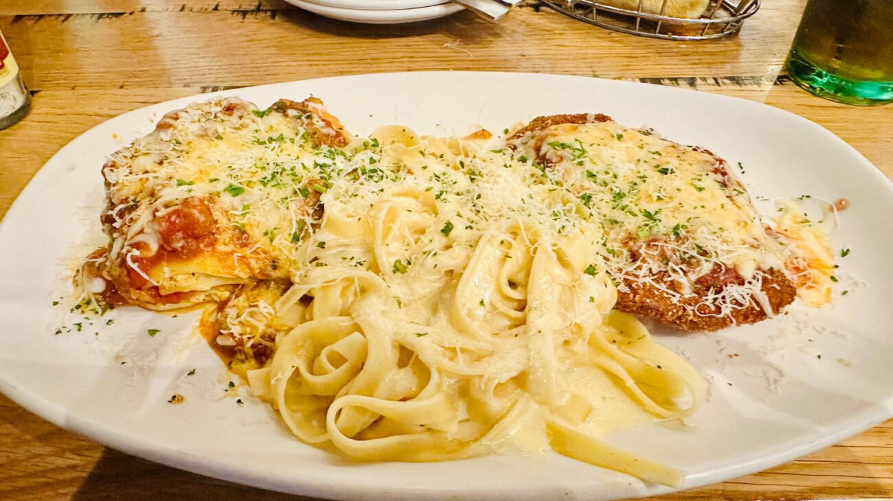 The Cheese That Olive Garden Servers Grate On Your Food Isn't Parmesan